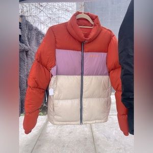 Cotopaxi W Sm orange, lavender, and cream puffer.